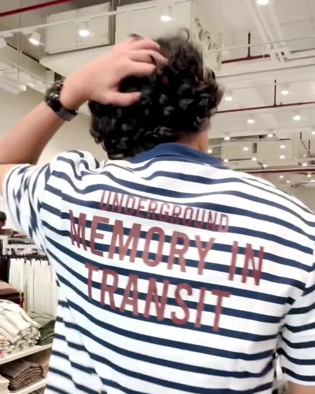 Aayan from behind in a striped Zudio tee