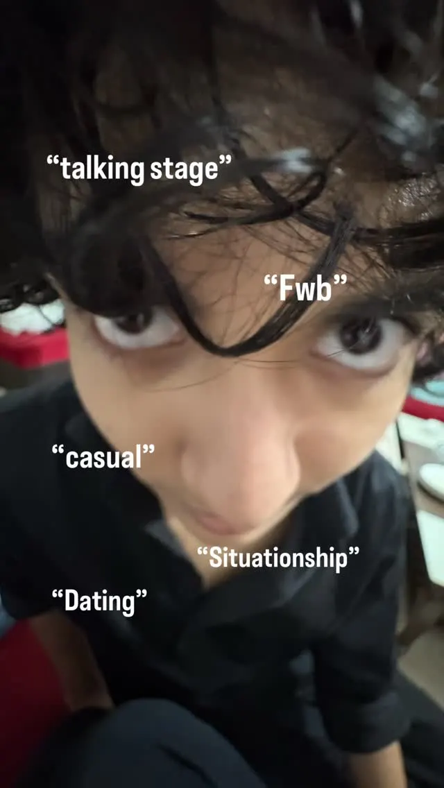 Aayan leaning into the camera with dating-term captions around him